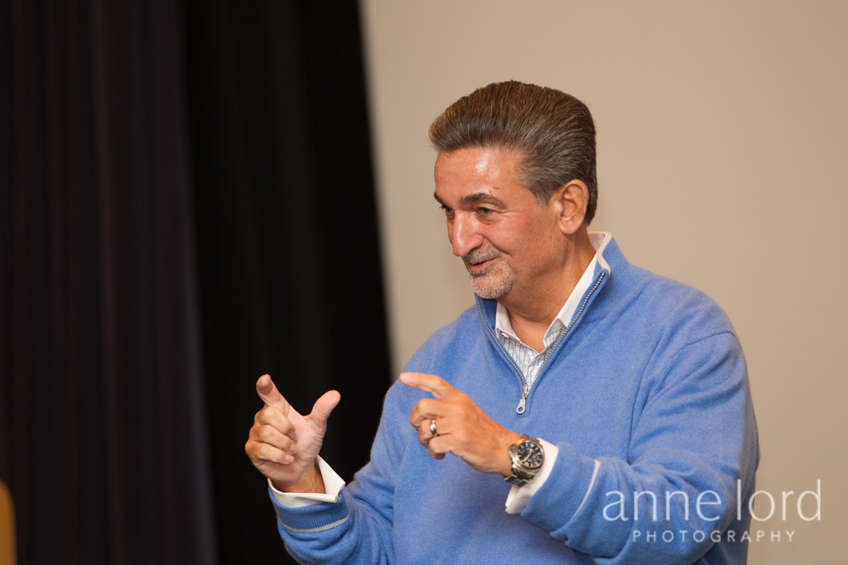 Mindshare Leonsis giving talk wearing blue | Anne Lord Photography