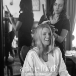 Bride's hair fixing by hairstylist | Anne Lord Photography