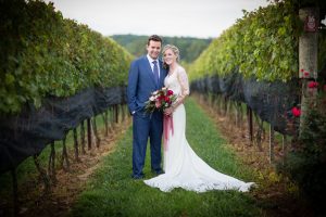 newly weds in a garden | Anne Lord Phtography