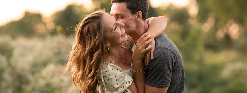 Anne Lord Photography - engagement photo of a young man and woman embracing